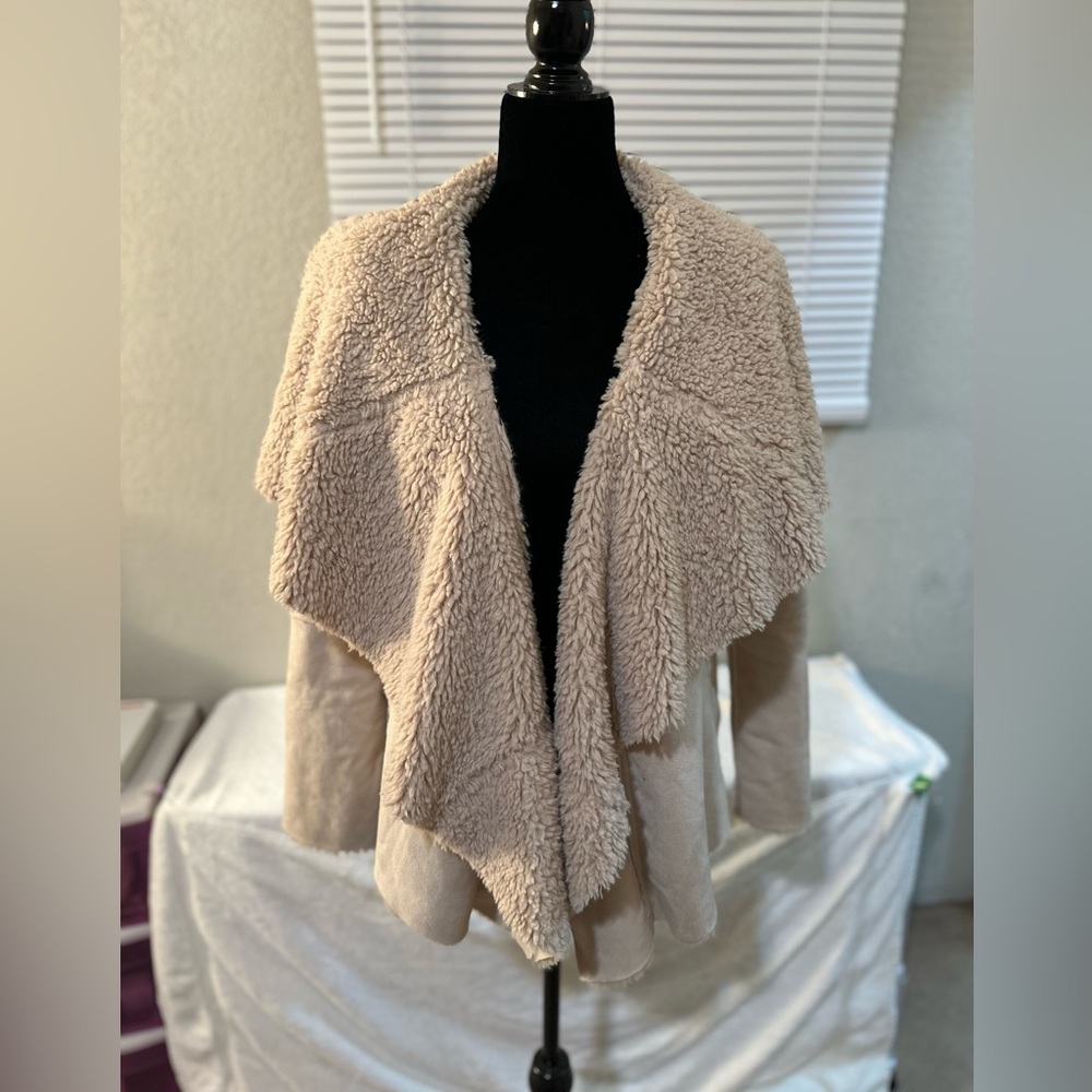 Cream colored, luxurious warm winter fashion coat from Lake Tahoe. Soft faux fur